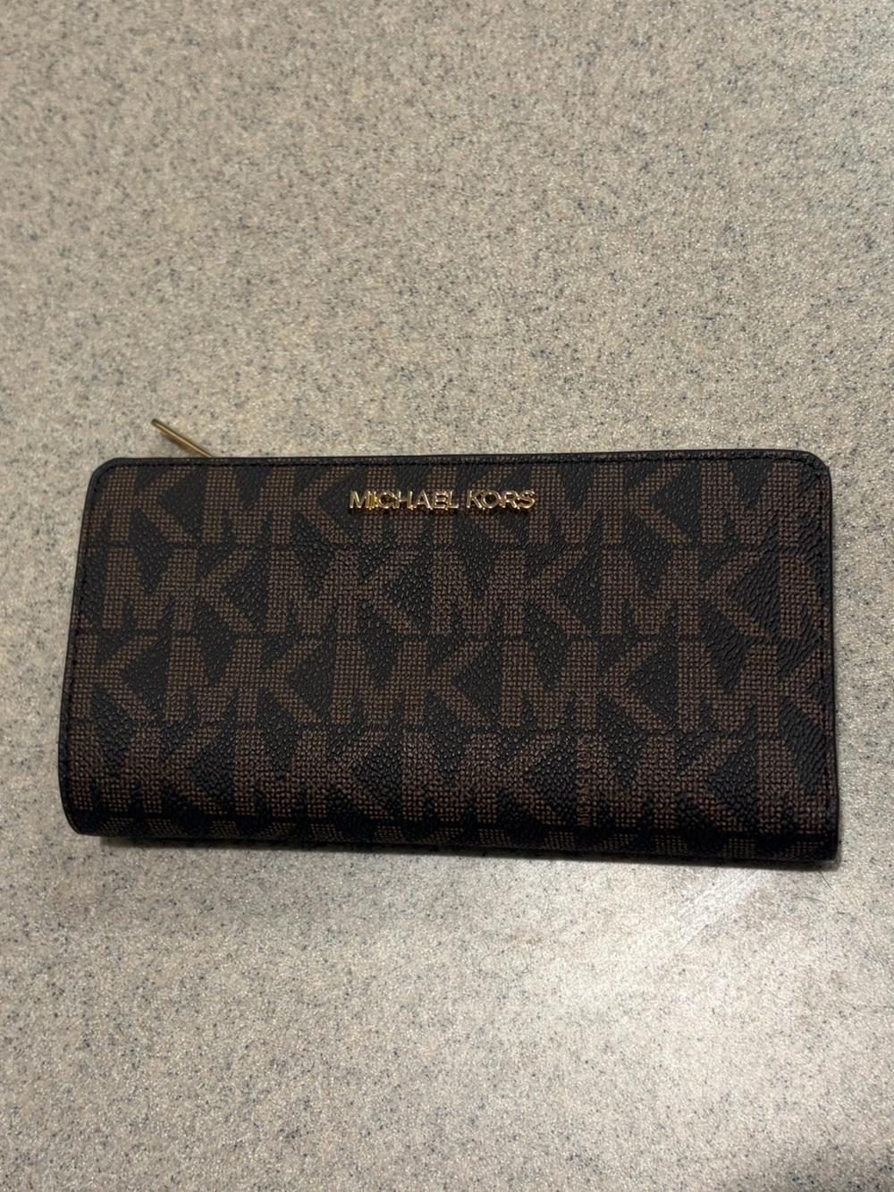 Brand new Michael Kors Brown Monogram Zip Wallet with Gold Logo